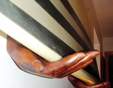 beatnik hands surfboard rack holding board