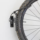 bike storage hook holds bicycle wheel